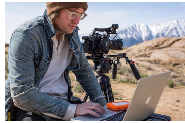 Filmmaker Chris Hershman editing in the field